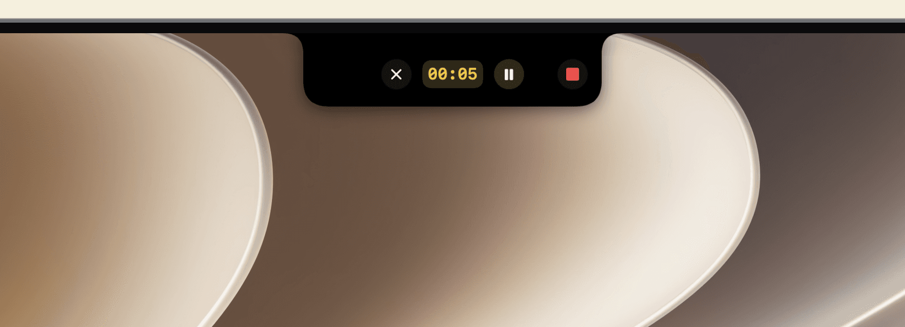 Mac display bezel with Memo’s recording notch showing the timer, pause, and stop controls